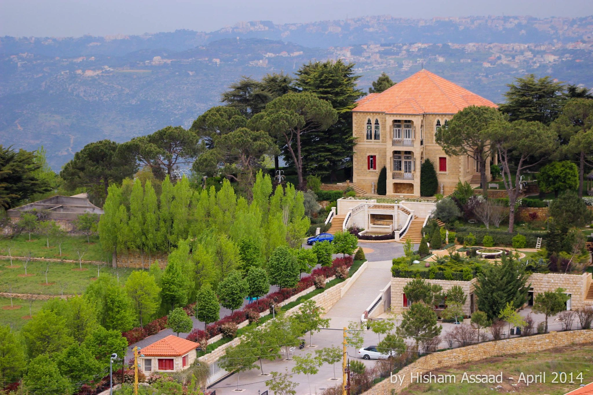 Historic stone mansion surrounded by pine trees and terraced gardens in the mountains of Aley, Lebanon