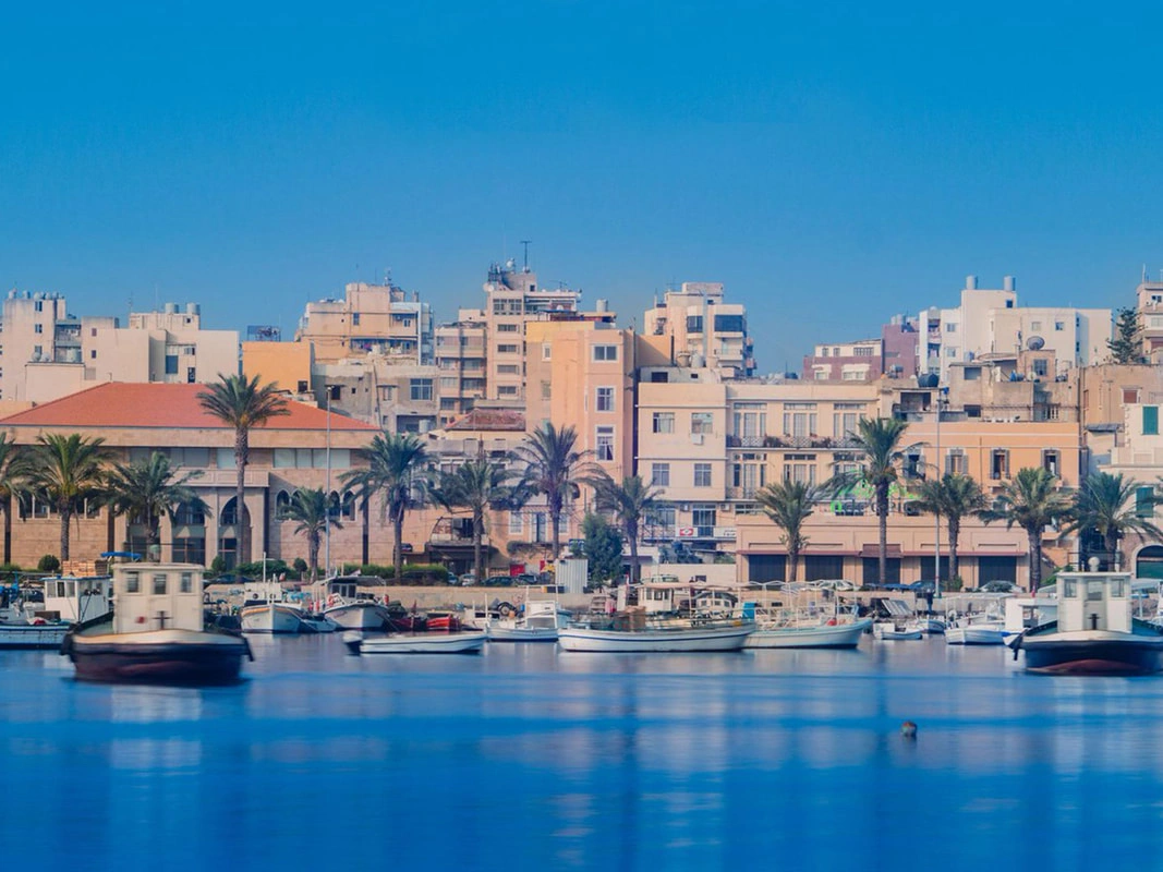 Fishing boats docked along Al-Mina promenade in Tripoli, Lebanon